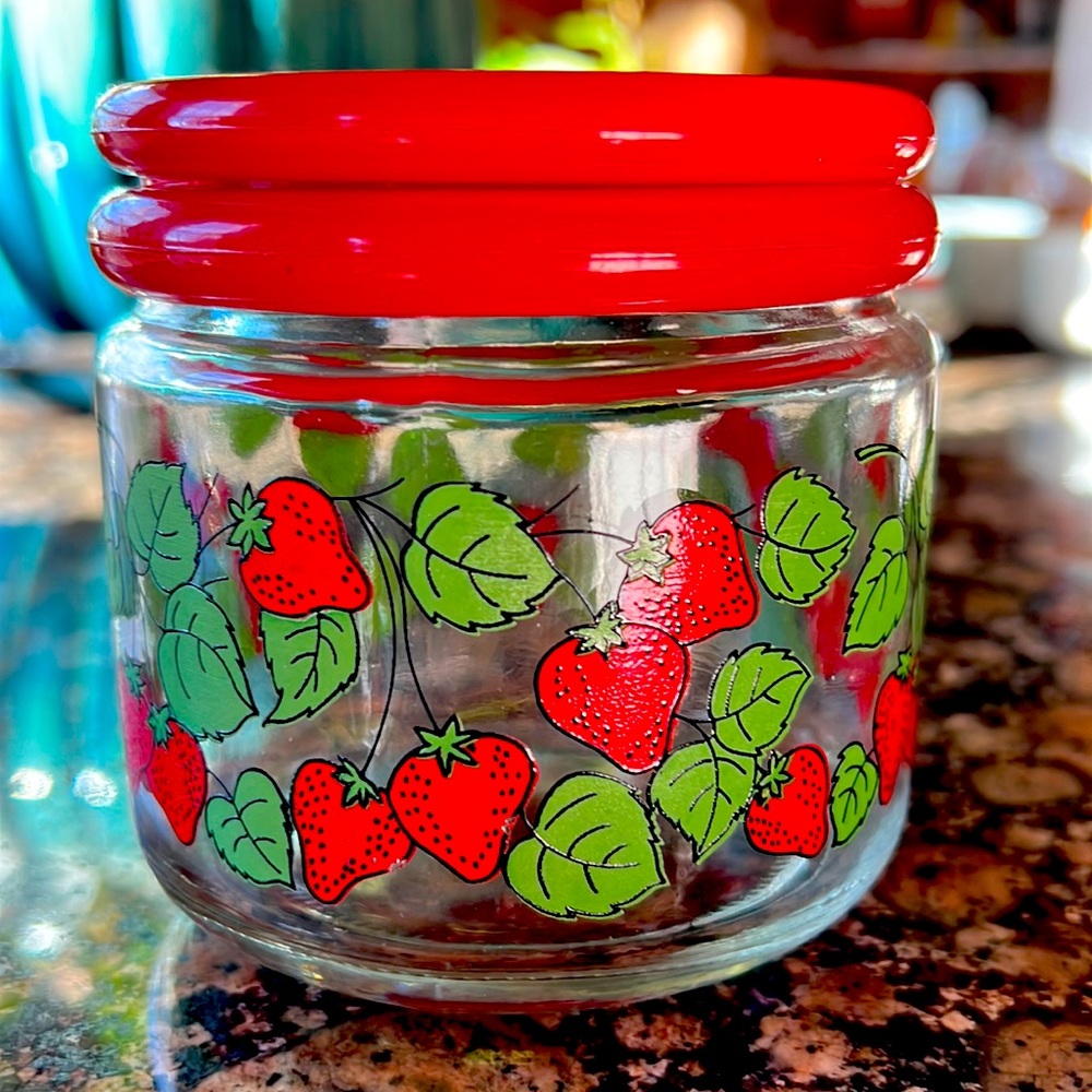 Strawberry canister with red plastic lid